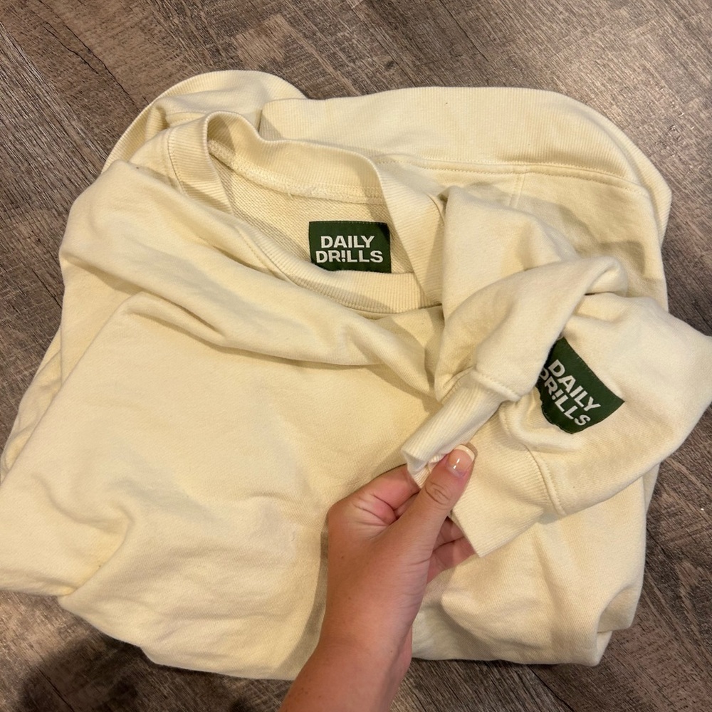 Daily drills brand new. Color is sand. Oversized crew